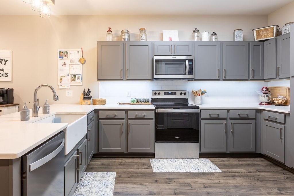1578 Old Gallatin Road Portland, TN 37148 - Photo 10 of 32 a kitchen with stainless steel appliances granite countertop a sink stove and microwave