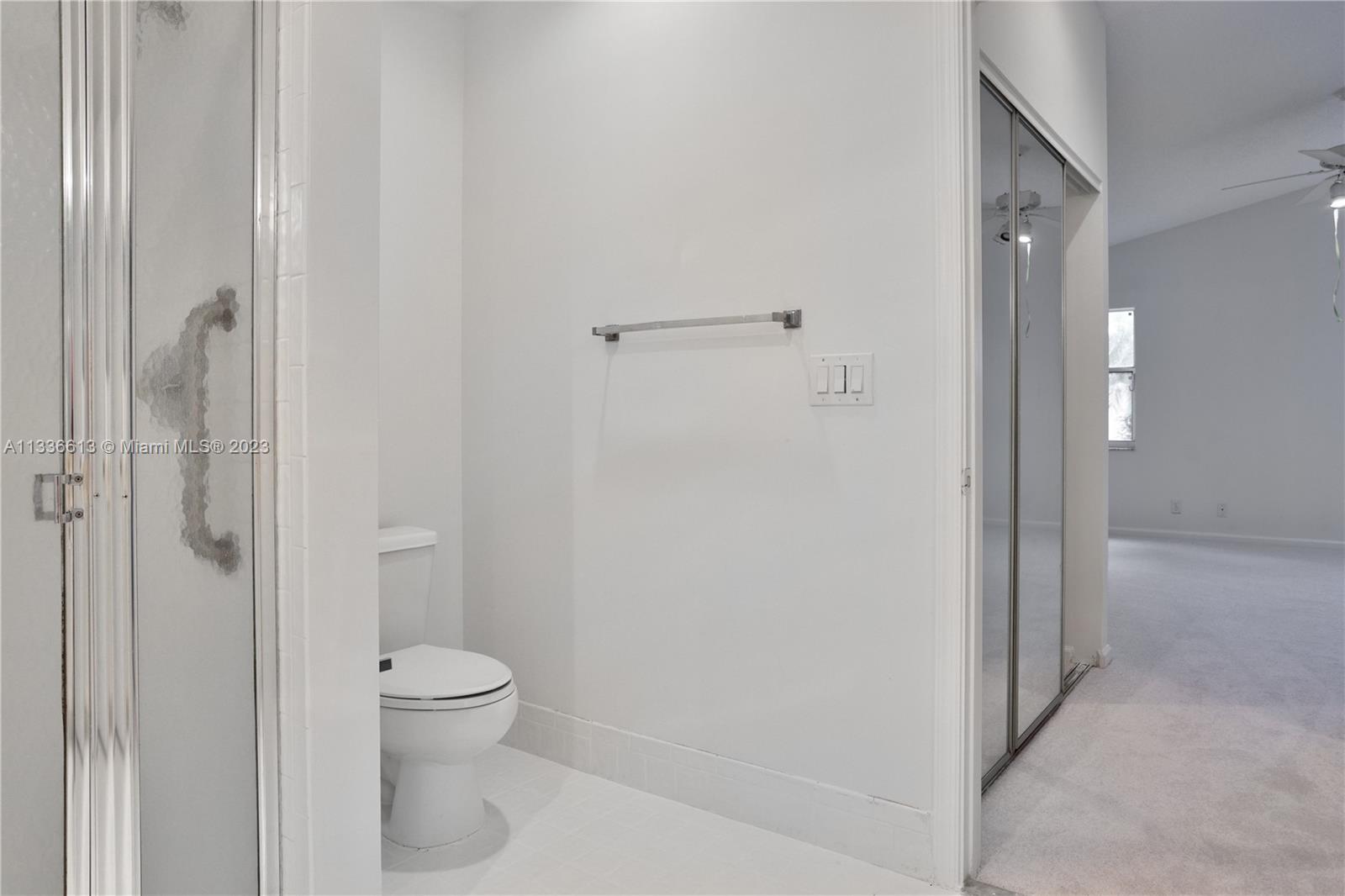 9650 Harbour Lake Circle Boynton Beach, FL 33437 - Photo 18 of 37 a bathroom with a toilet and shower