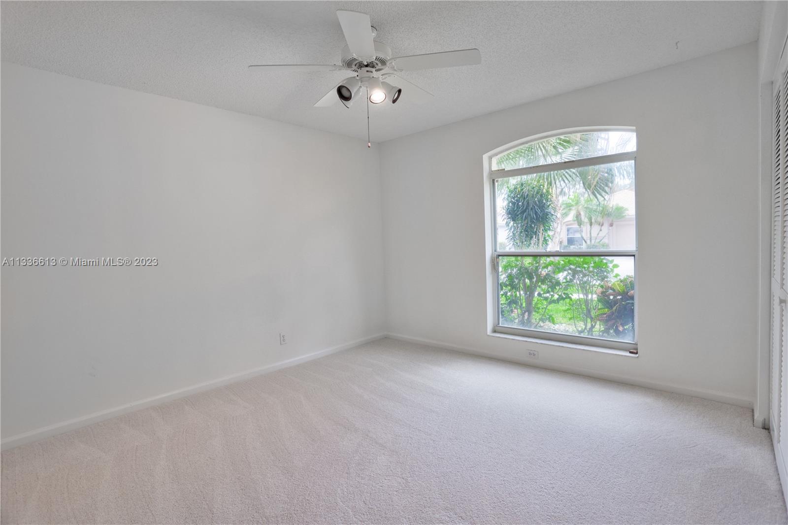 9650 Harbour Lake Circle Boynton Beach, FL 33437 - Photo 20 of 37 an empty room with a window