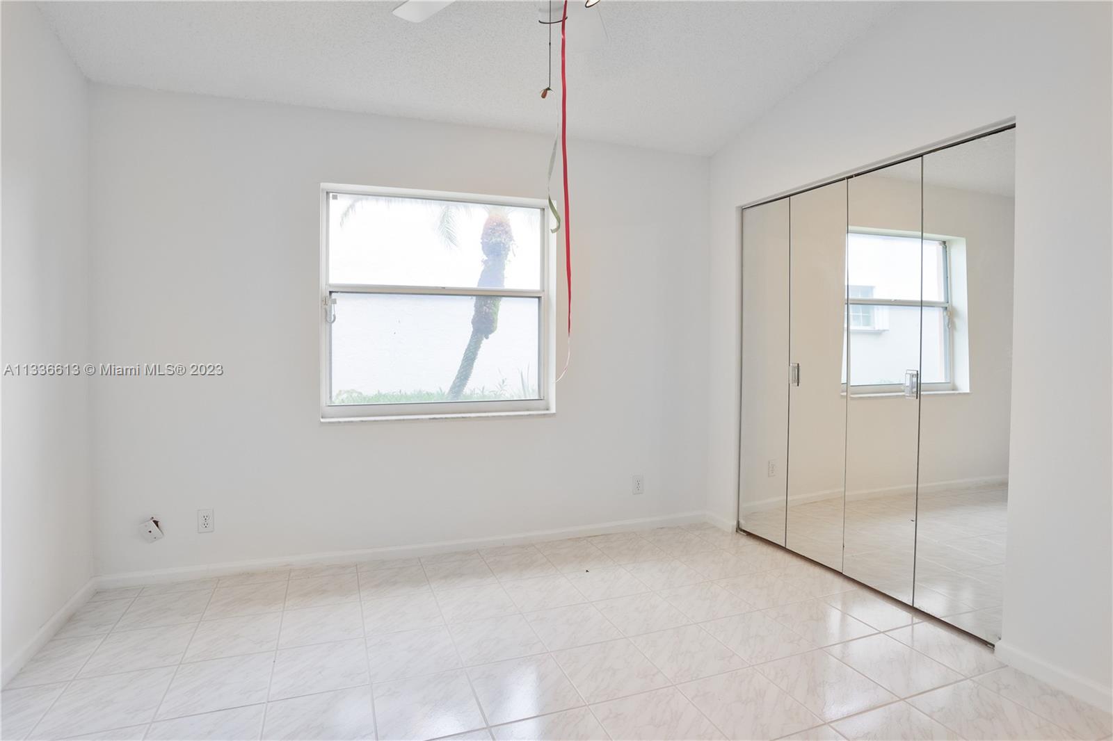9650 Harbour Lake Circle Boynton Beach, FL 33437 - Photo 22 of 37 a view of an empty room with a window