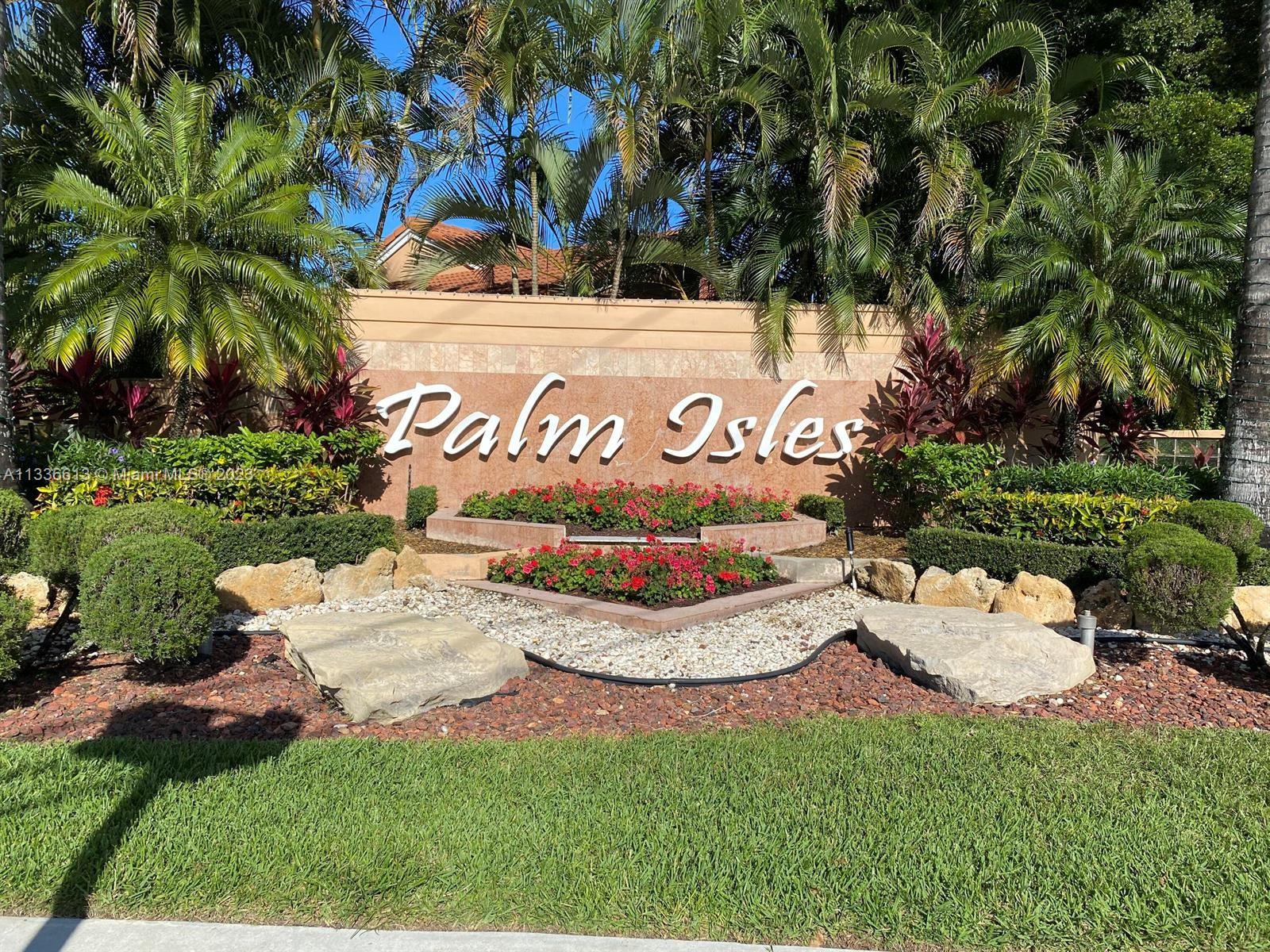 9650 Harbour Lake Circle Boynton Beach, FL 33437 - Photo 24 of 37 a sign that is sitting in front of flowers