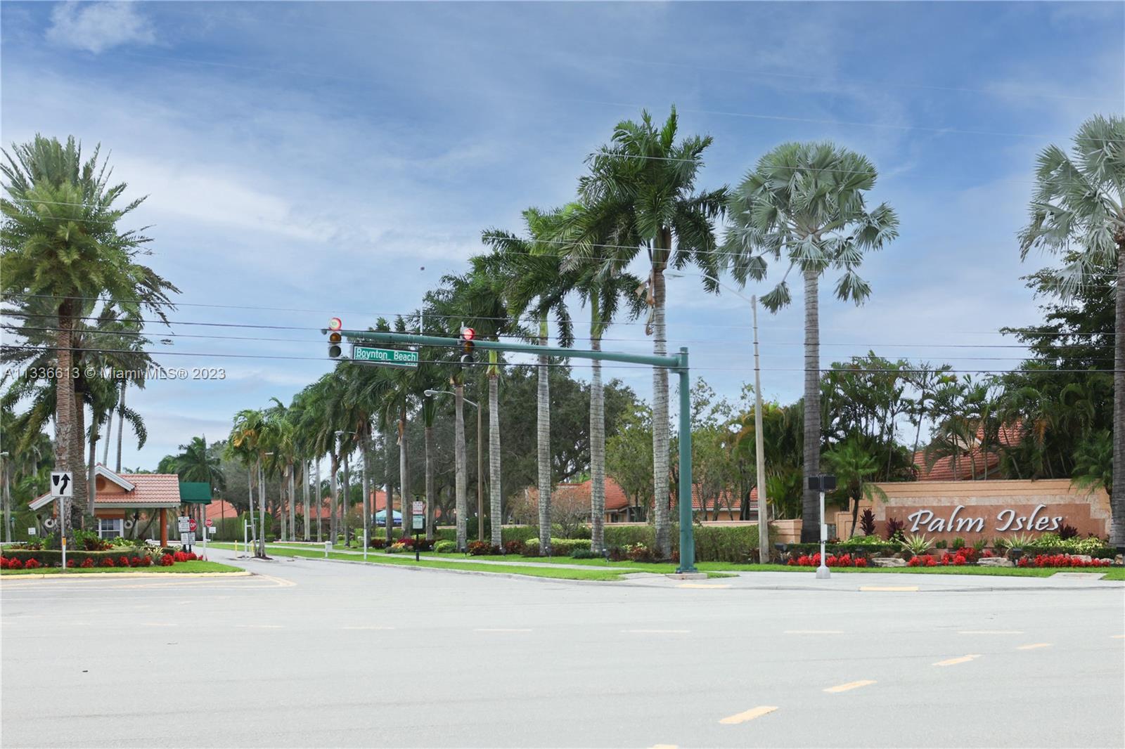 9650 Harbour Lake Circle Boynton Beach, FL 33437 - Photo 25 of 37 front view of a building with a street