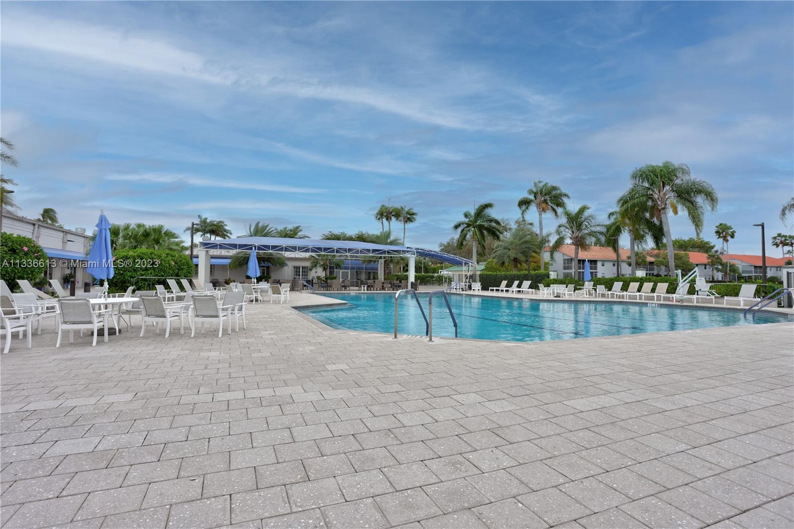 9650 Harbour Lake Circle Boynton Beach, FL 33437 - Photo 26 of 37 a view of a swimming pool and a yard
