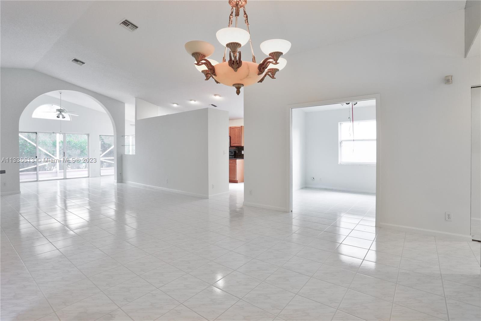 9650 Harbour Lake Circle Boynton Beach, FL 33437 - Photo 6 of 37 a view of a livingroom with a chandelier fan