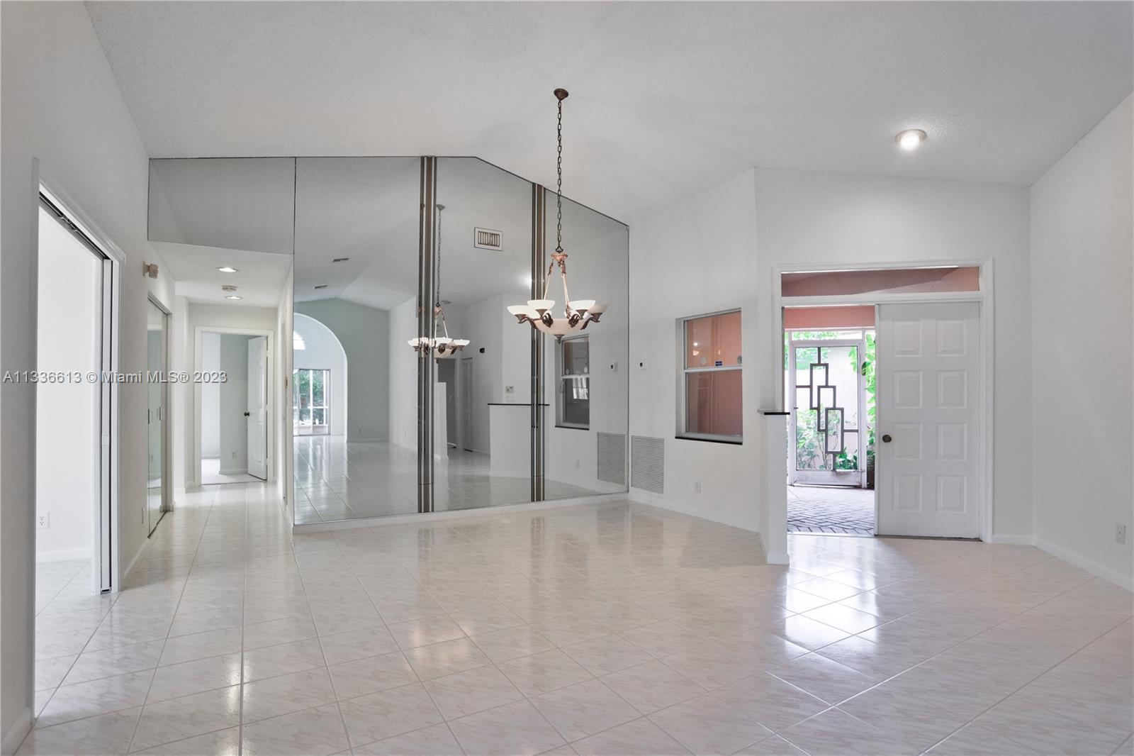 9650 Harbour Lake Circle Boynton Beach, FL 33437 - Photo 10 of 37 a view of a hallway with wooden floor and windows