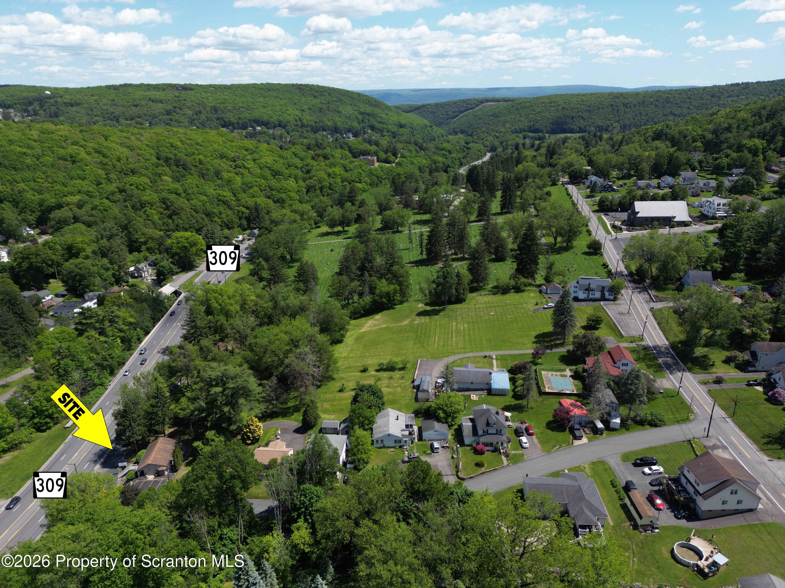 1674 North Memorial Highway Shavertown, PA 18708 - Photo 3 of 8 an aerial view of residential houses with outdoor space and trees all around