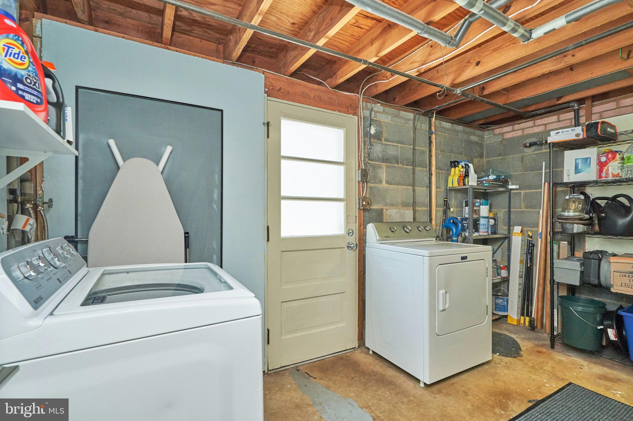 6519 Haystack Road Alexandria, VA 22310 - Photo 27 of 37 Large laundry/storage room with door to back patio