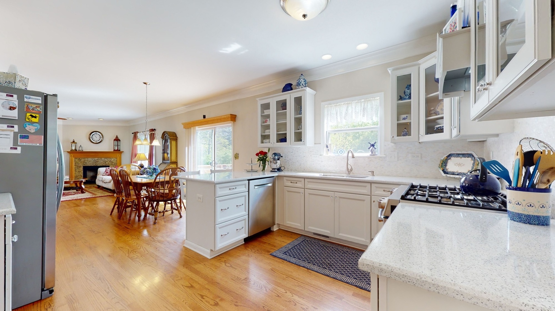 787 Laurel Lane Cary, IL 60013 - Photo 14 of 37 a kitchen with sink cabinets and dining table chair