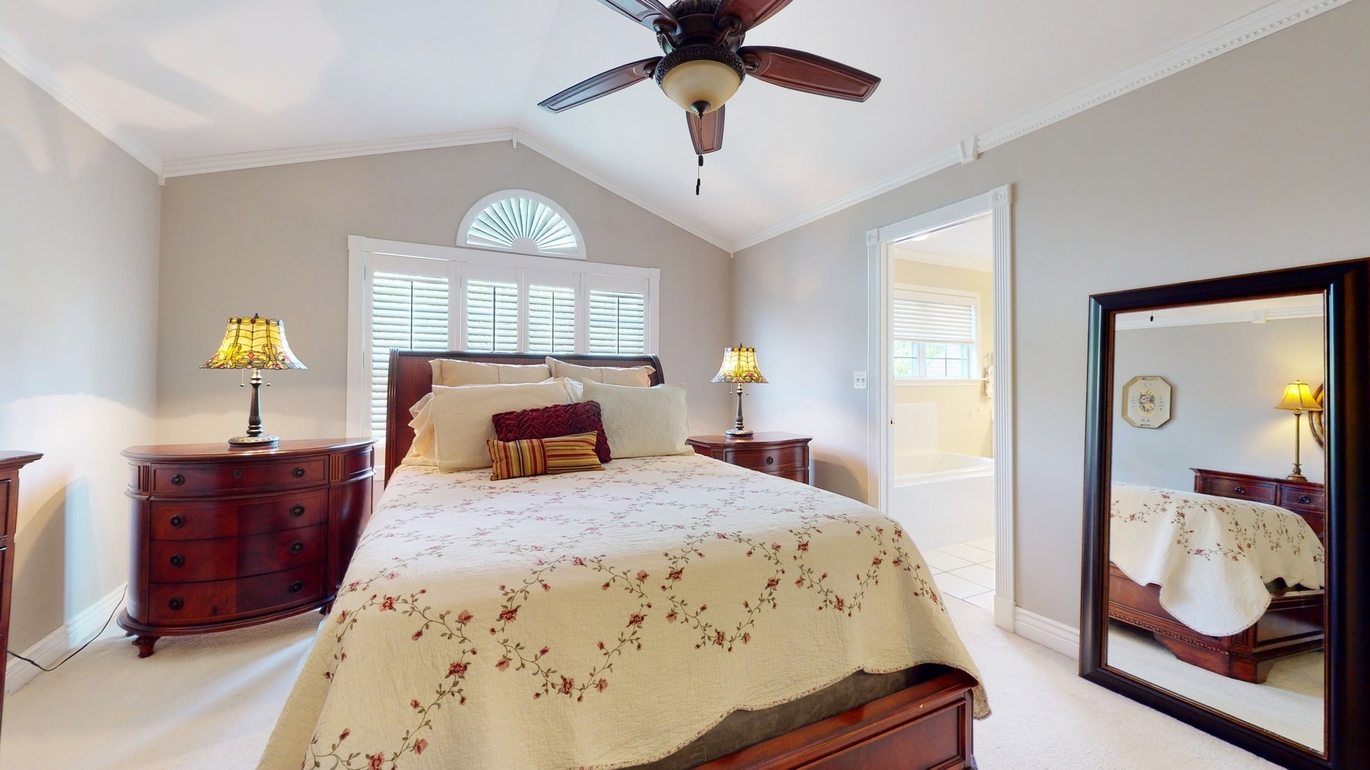 787 Laurel Lane Cary, IL 60013 - Photo 19 of 37 a bedroom with a bed and a chandelier