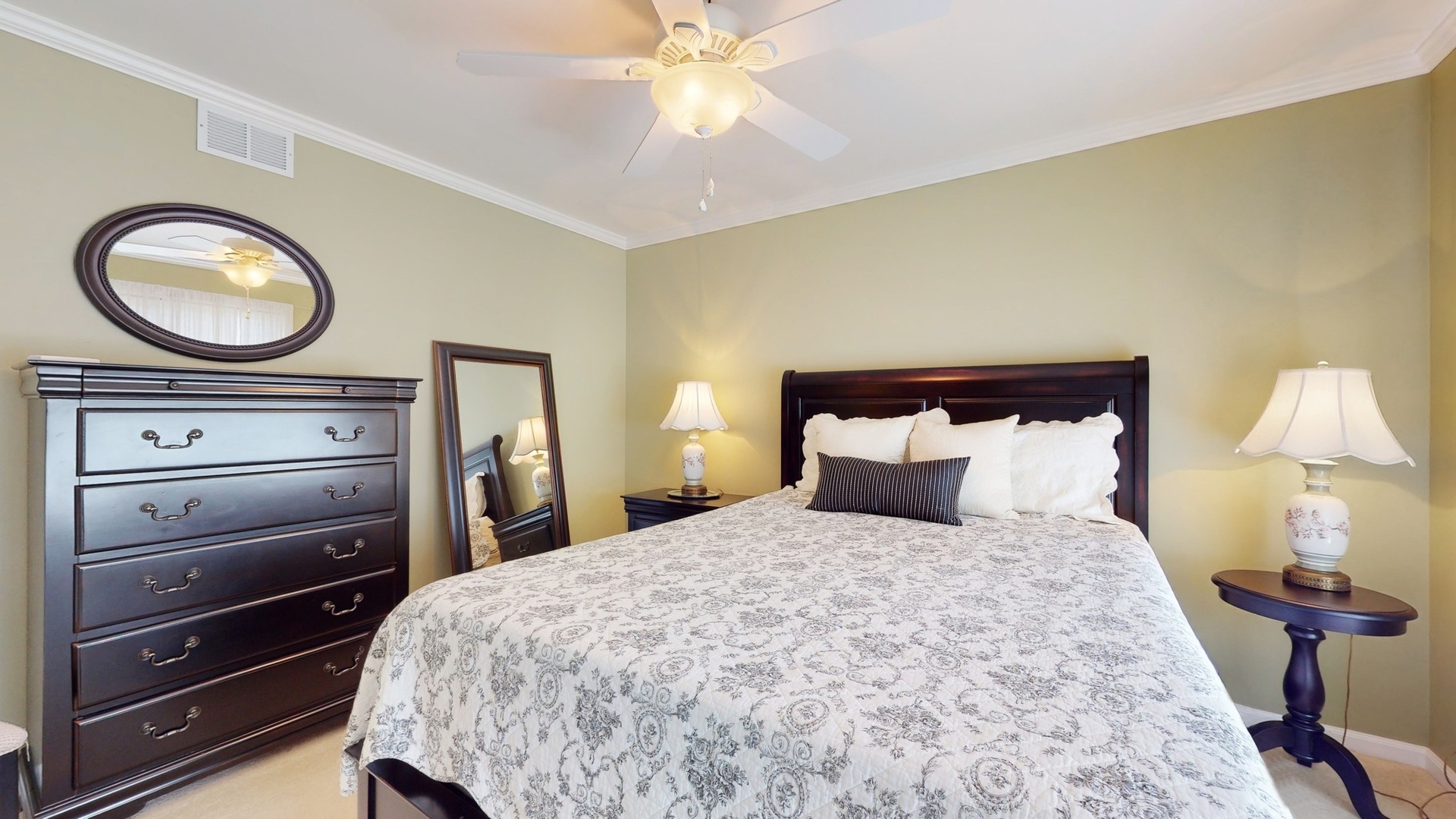 787 Laurel Lane Cary, IL 60013 - Photo 26 of 37 a bedroom with a bed and a chandelier