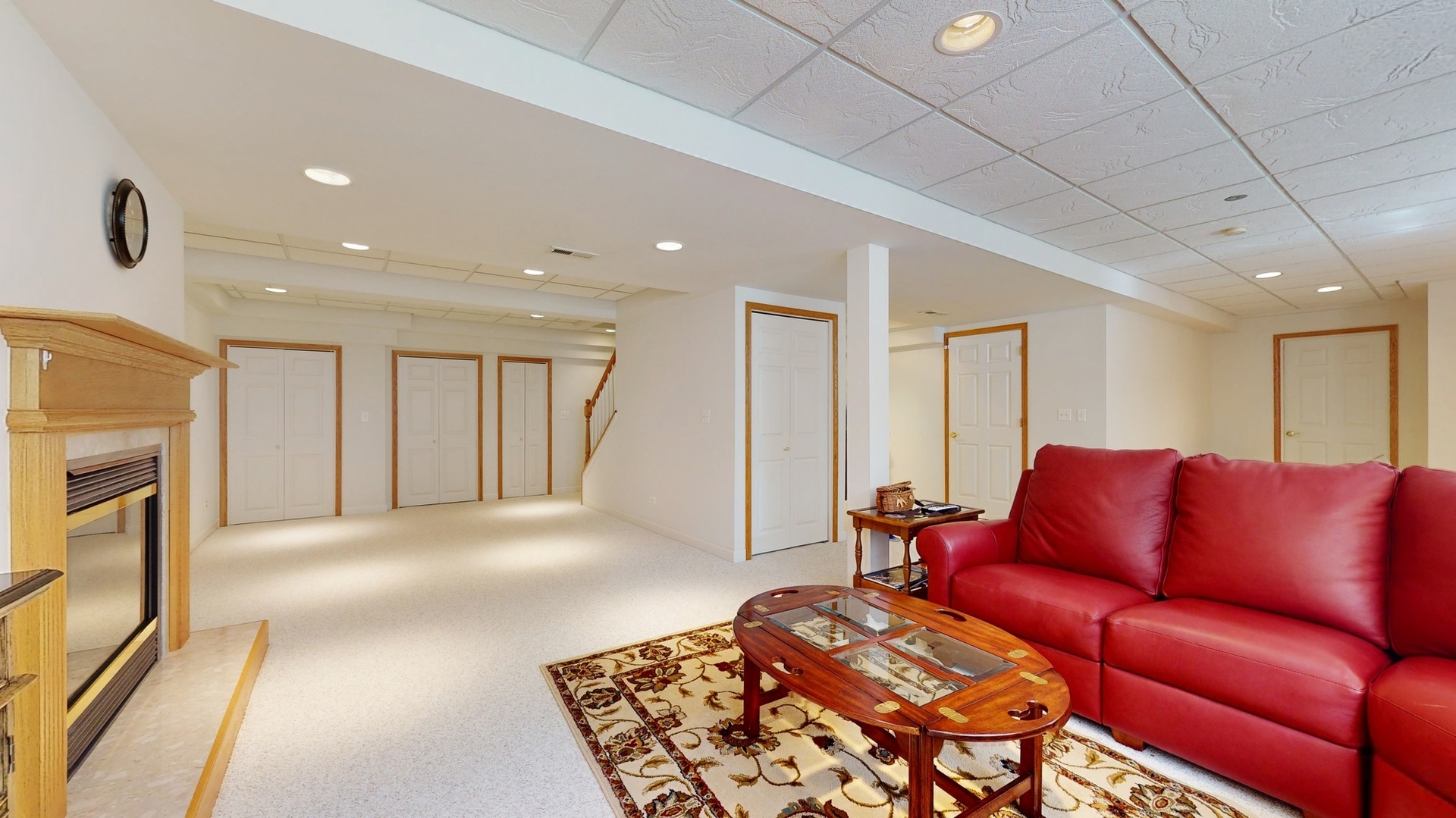 787 Laurel Lane Cary, IL 60013 - Photo 30 of 37 a living room with furniture a fireplace and a flat screen tv