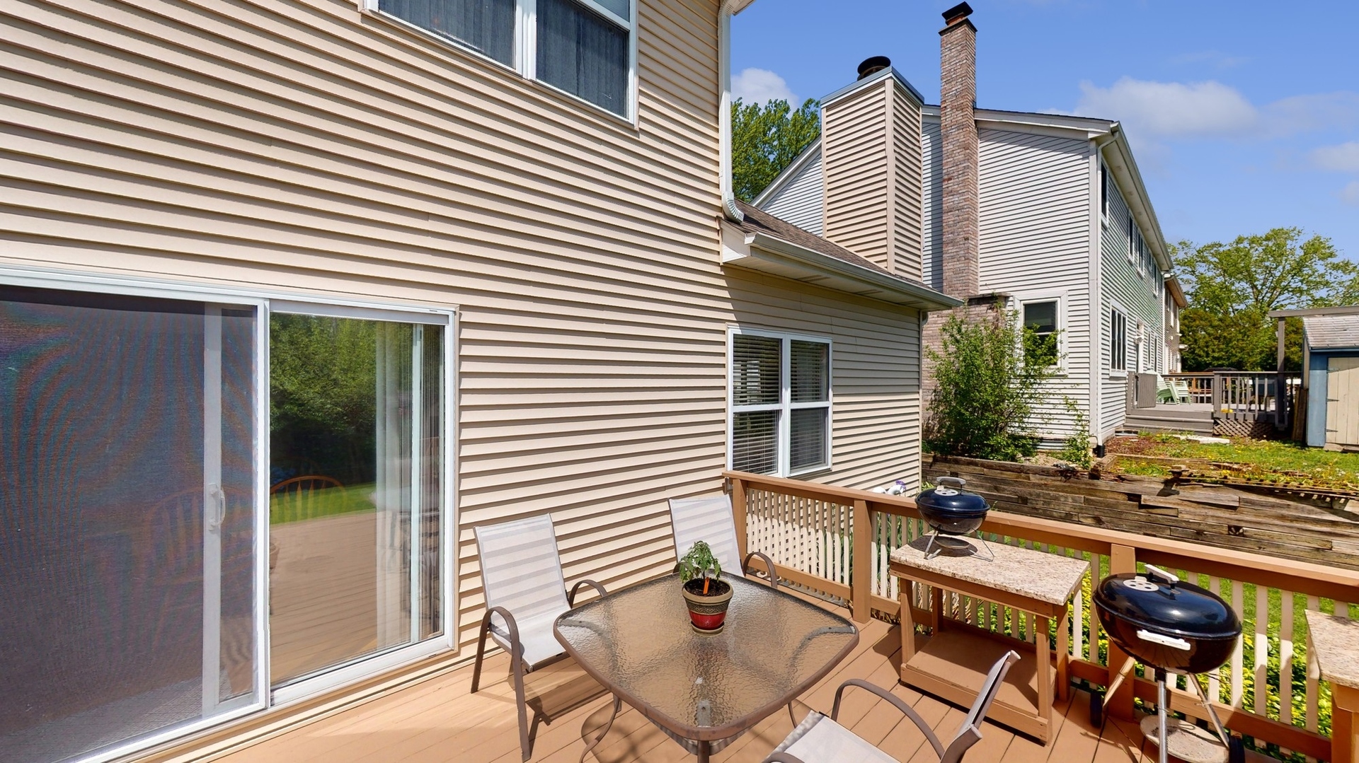 787 Laurel Lane Cary, IL 60013 - Photo 33 of 37 a view of a patio with table and chairs and potted plants