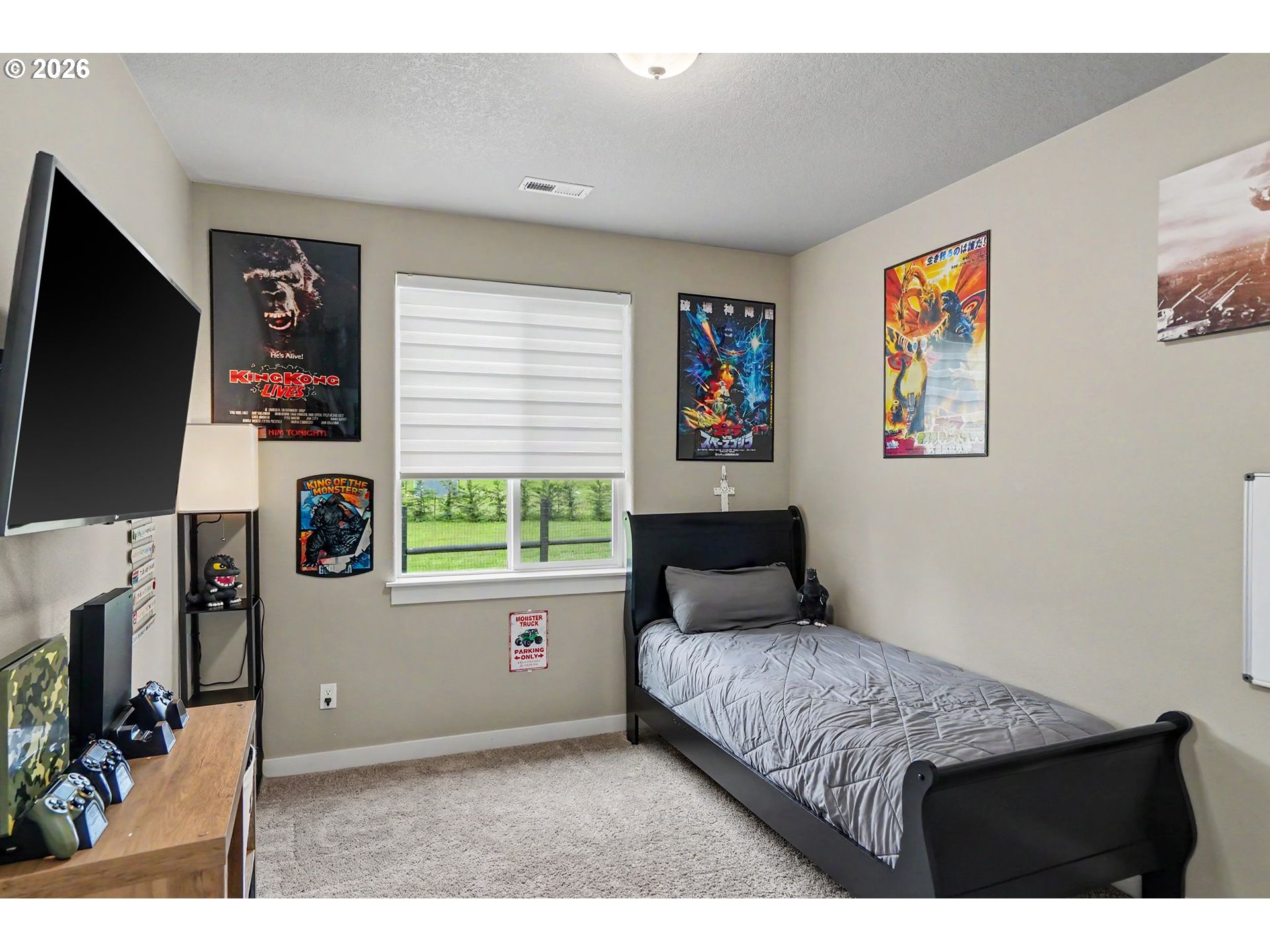 11862 Steinkamp Road Southeast Aumsville, OR 97325 - Photo 31 of 48 a bedroom with a bed and a flat screen tv