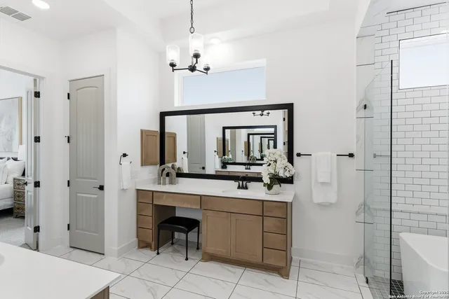 a en suite bathroom with a sink and a mirror