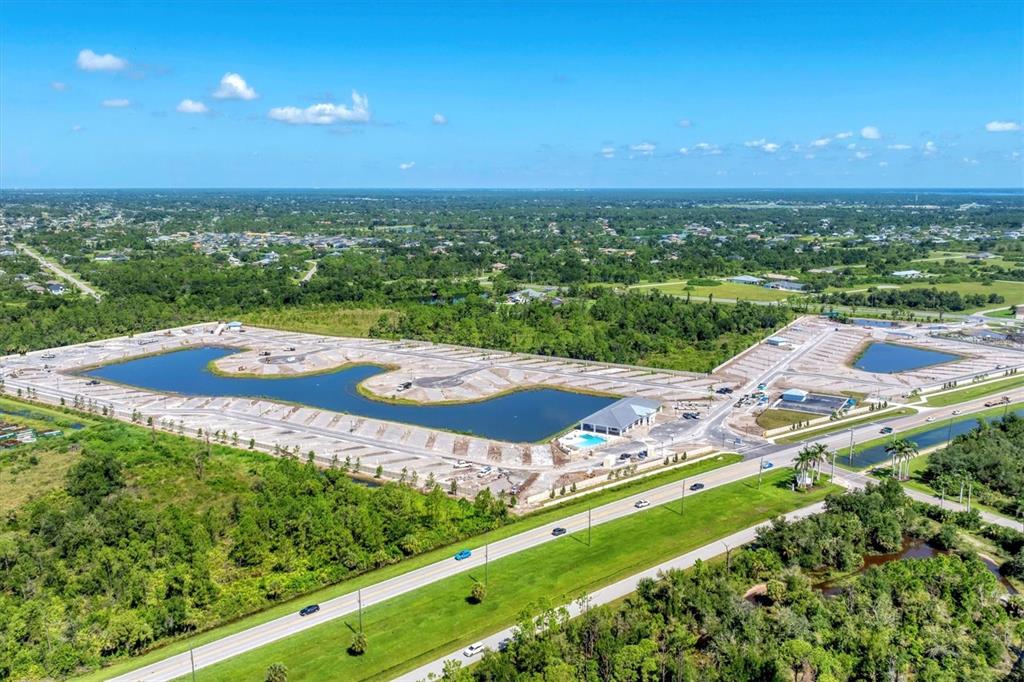 9001 Gasparilla Road, Unit 86 Placida, FL 33947 - Photo 14 of 75 an aerial view of residential houses with outdoor space and trees