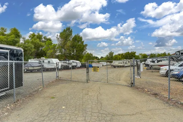 a view of a car park in front of house