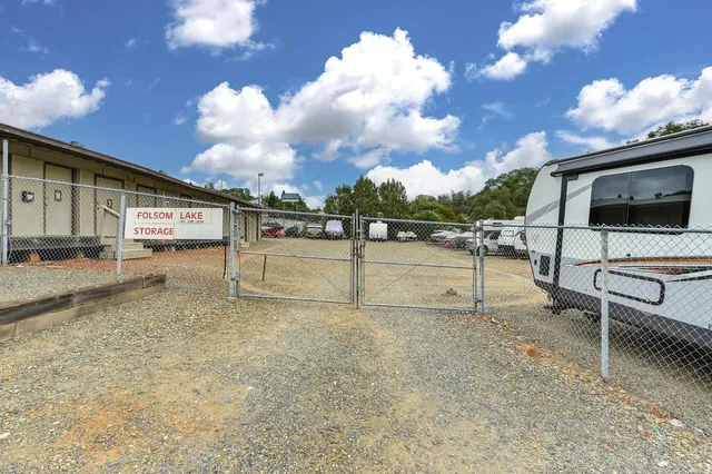 a view of car parked in parking lot of house