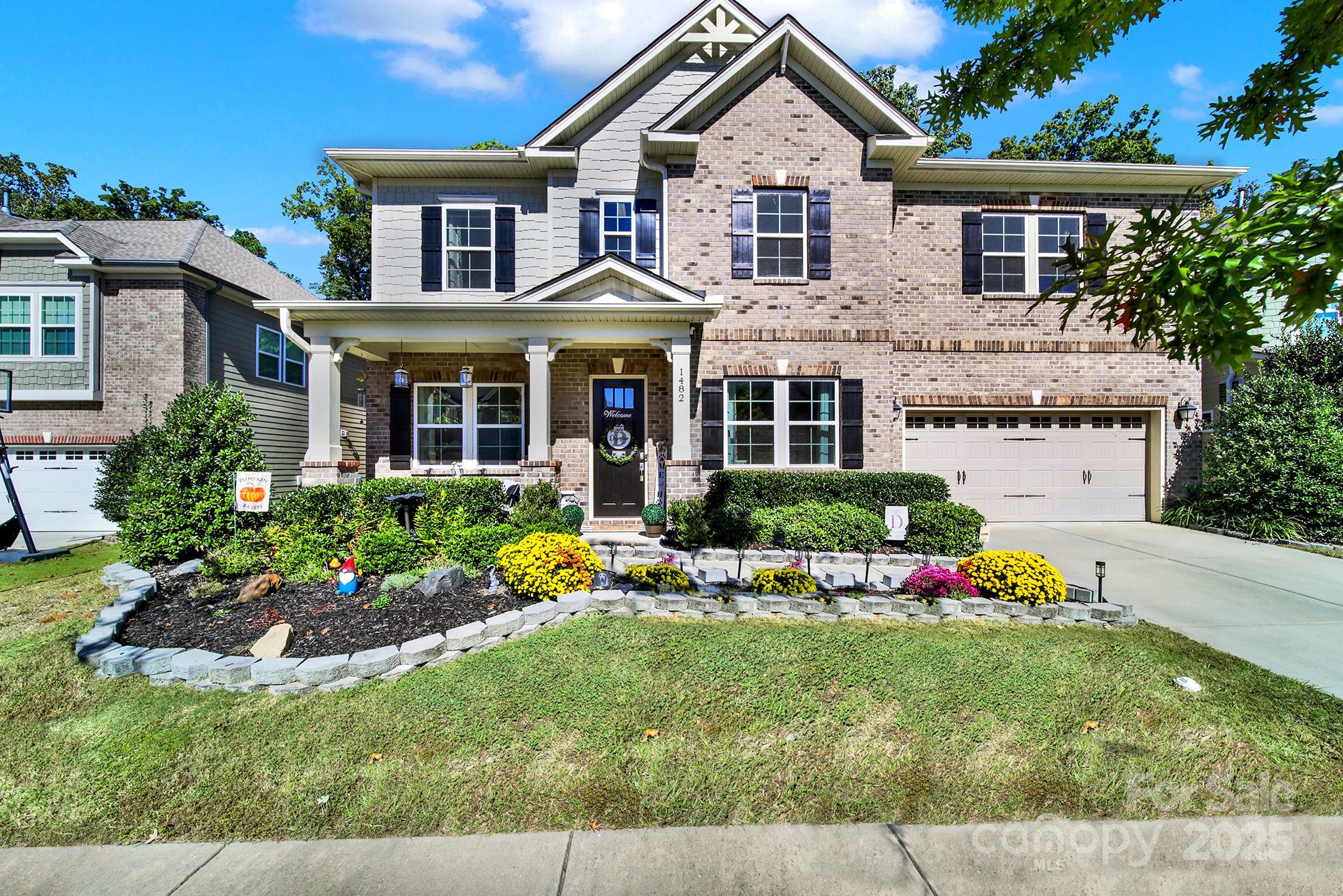 1482 Afton Way Fort Mill, SC 29708 - Photo 1 of 11 a front view of a house with garden