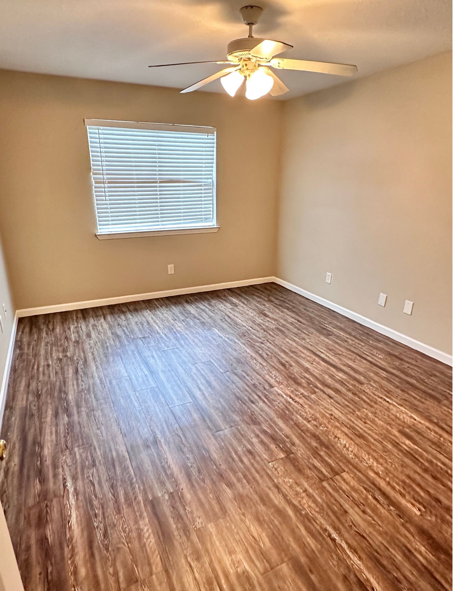 22707 Bridgewater Drive Spring, TX 77373 - Photo 10 of 11 wooden floor in an empty room with a window