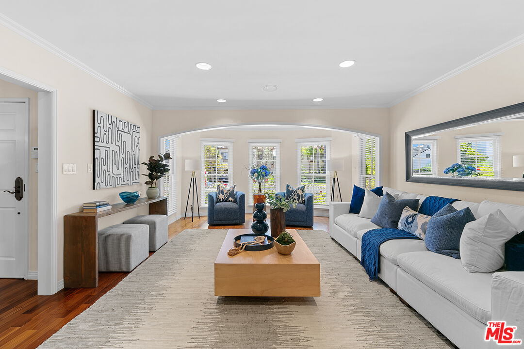14943 Alva Drive Pacific Palisades, CA 90272 - Photo 5 of 36 a living room with furniture and large windows