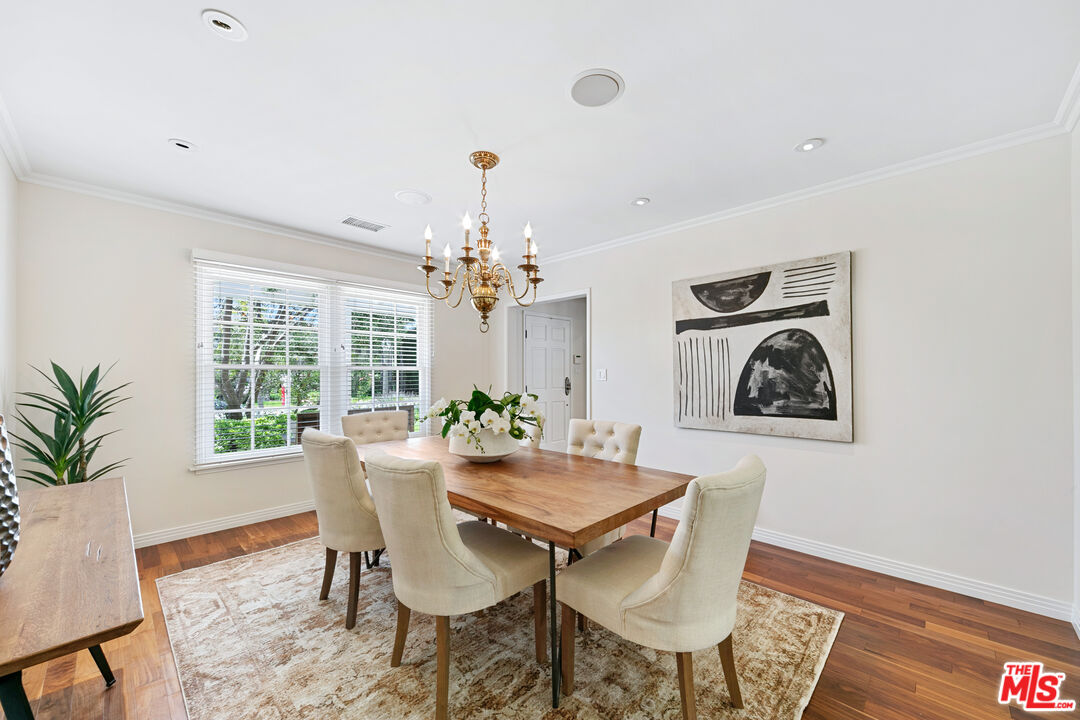 14943 Alva Drive Pacific Palisades, CA 90272 - Photo 8 of 36 a view of a dining room with furniture window and wooden floor
