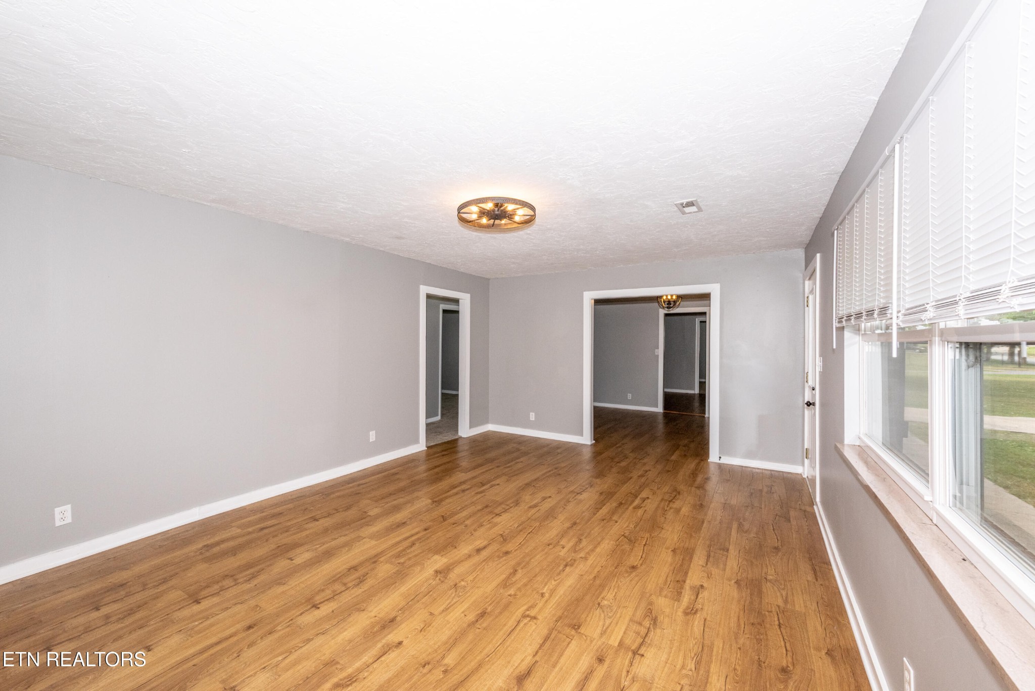 149 Moat Sewell Road Philadelphia, TN 37846 - Photo 33 of 35 a view of an empty room with wooden floor and a window
