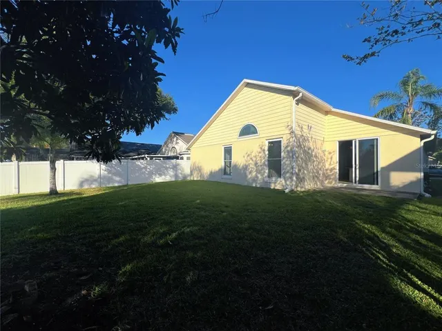 a view of a back yard of the house