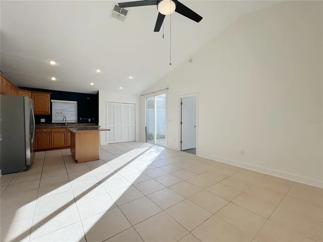 a view of a kitchen with a sink and stainless steel appliances