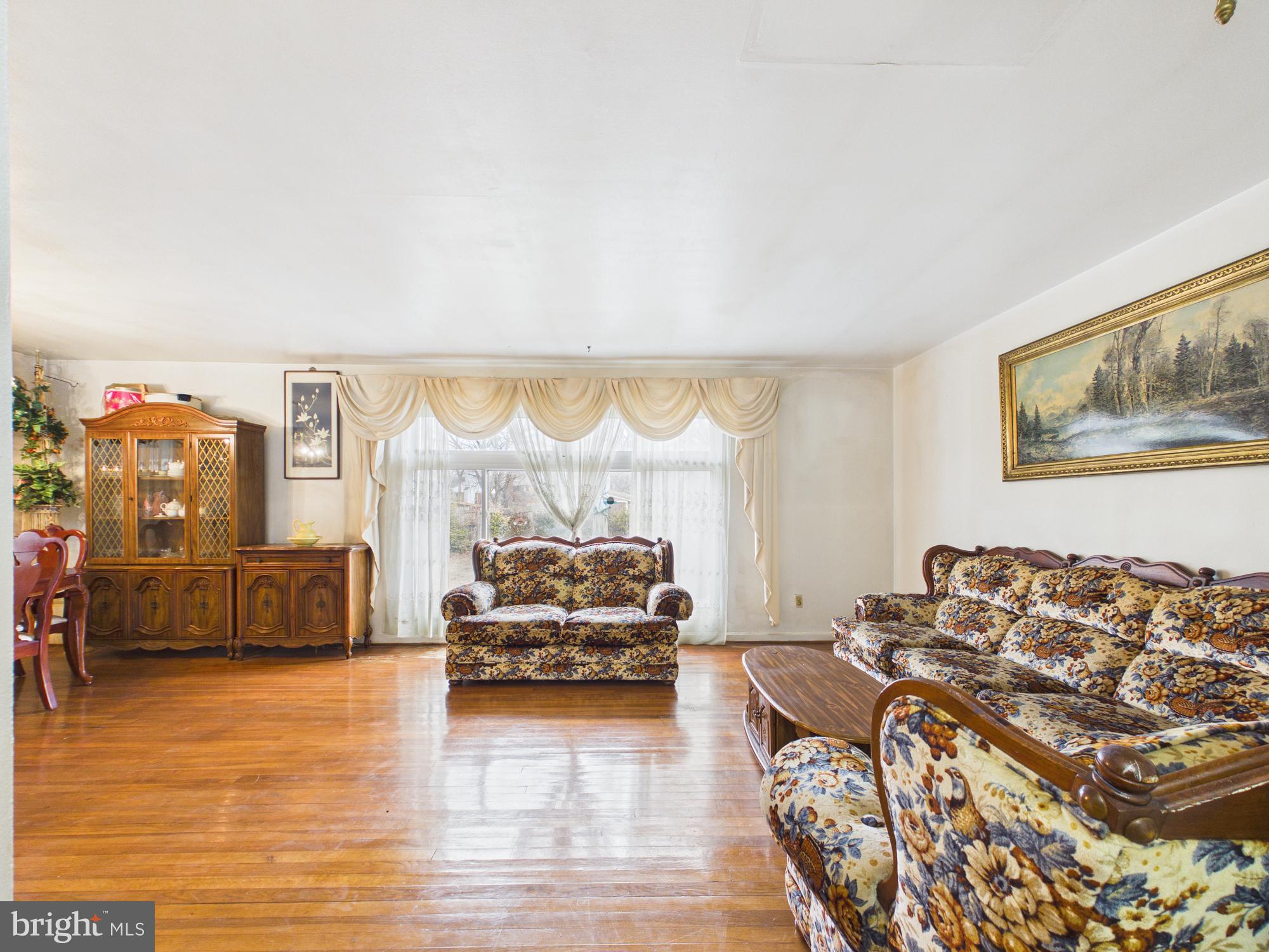5907 Camberly Avenue Springfield, VA 22150 - Photo 11 of 41 a living room with furniture and a large window