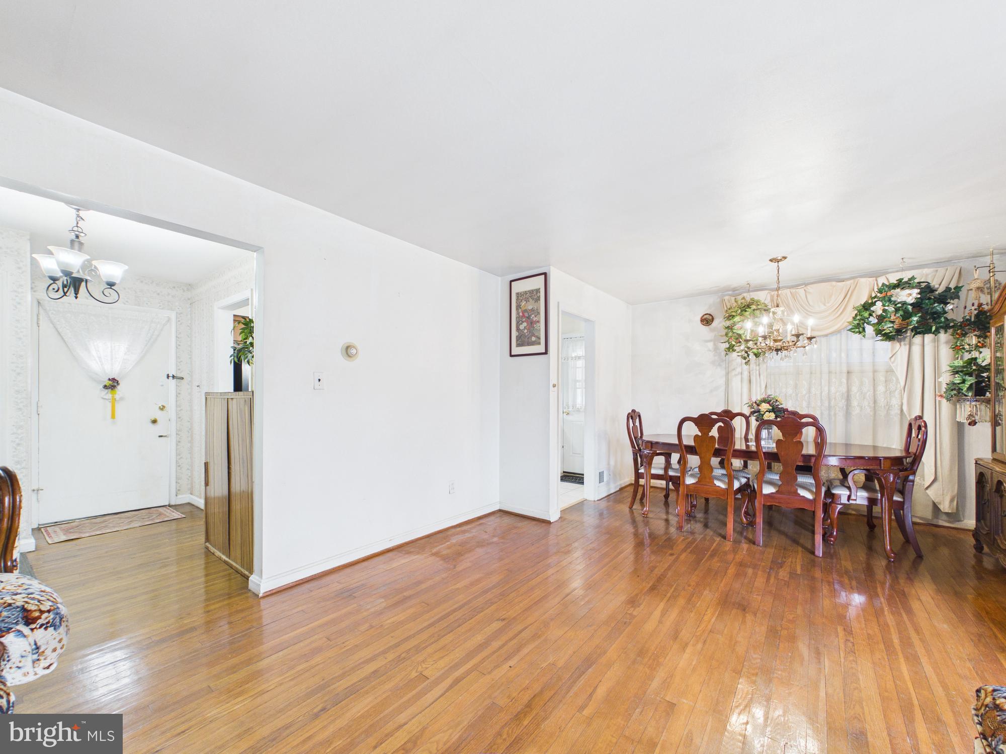 5907 Camberly Avenue Springfield, VA 22150 - Photo 12 of 41 a dining room with furniture and wooden floor