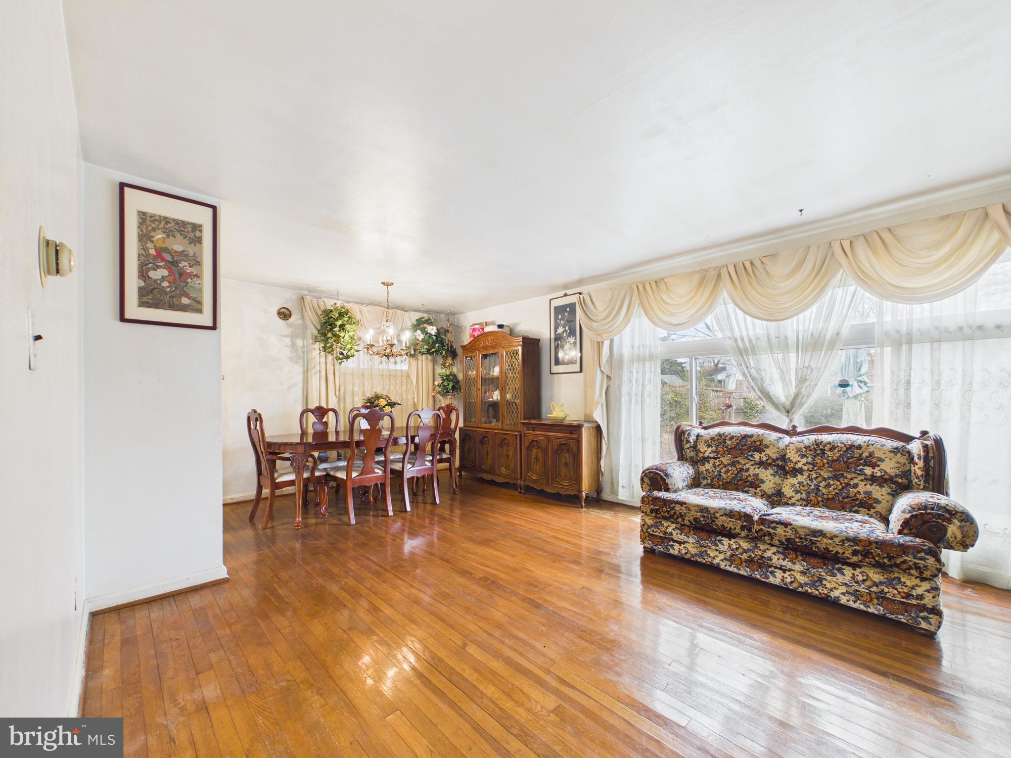 5907 Camberly Avenue Springfield, VA 22150 - Photo 13 of 41 a living room with furniture and a large window