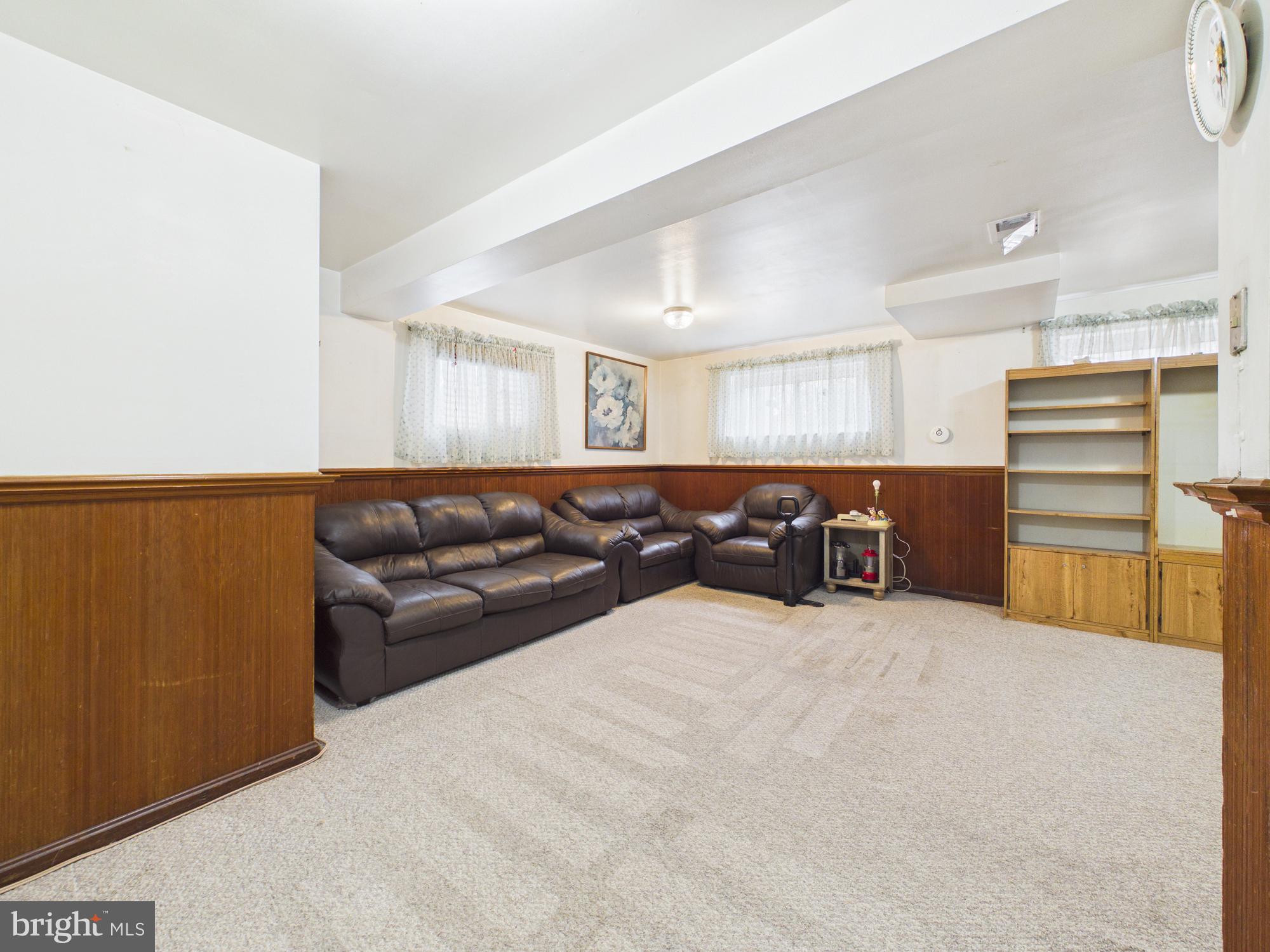 5907 Camberly Avenue Springfield, VA 22150 - Photo 15 of 41 a living room with furniture and kitchen view