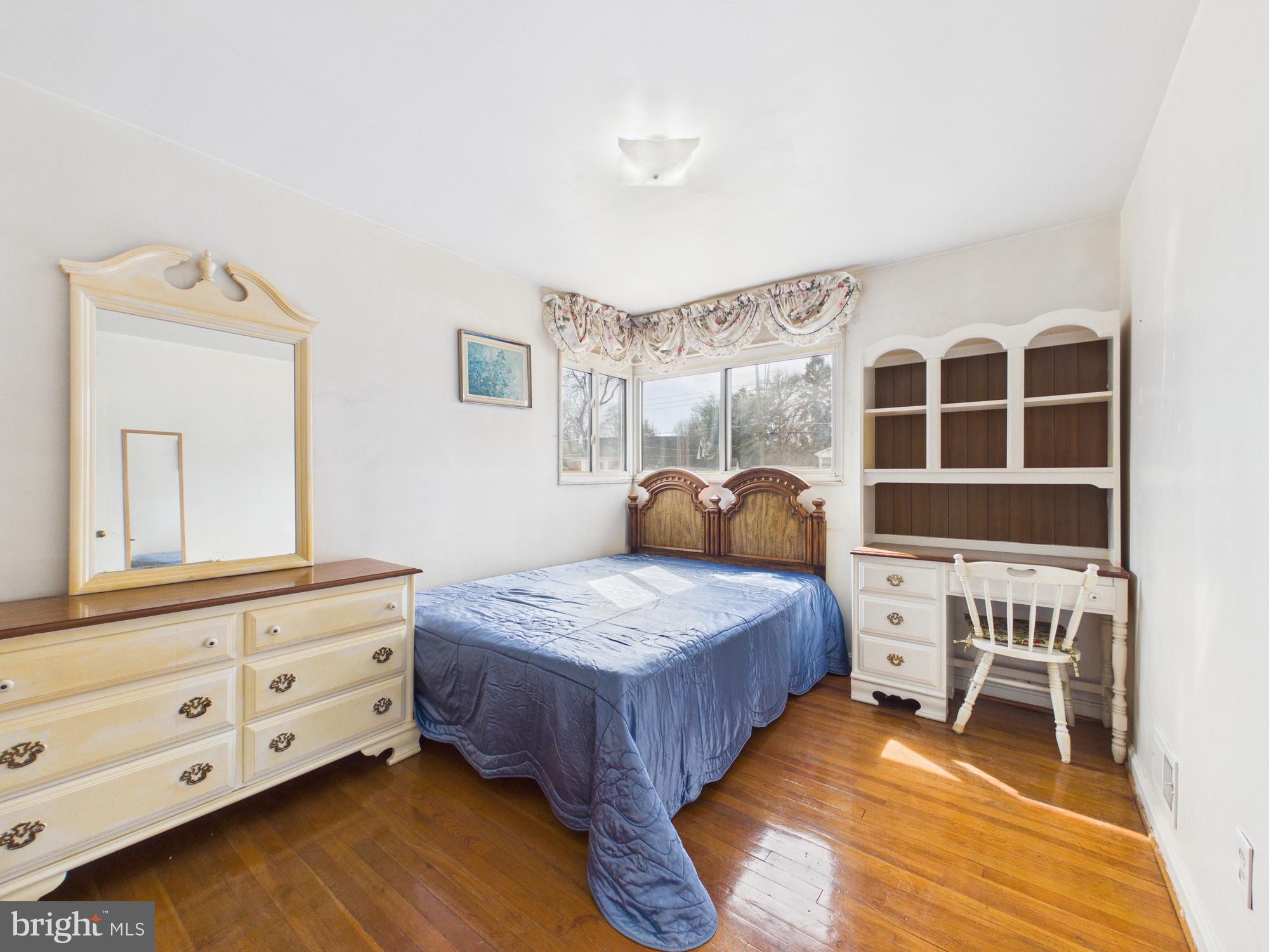 5907 Camberly Avenue Springfield, VA 22150 - Photo 24 of 41 a bedroom with a bed and a dresser