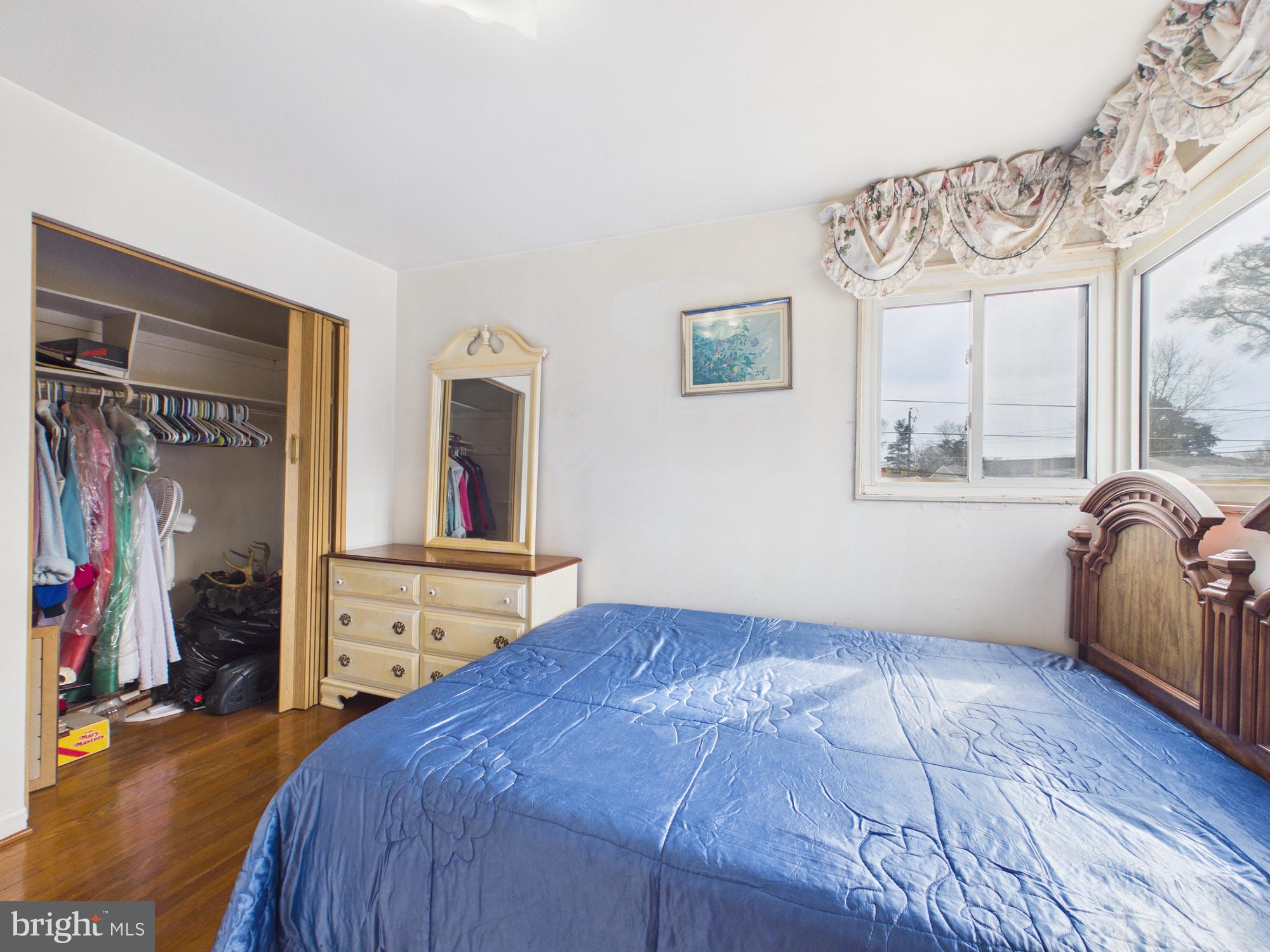 5907 Camberly Avenue Springfield, VA 22150 - Photo 25 of 41 a bedroom with a bed and a dresser