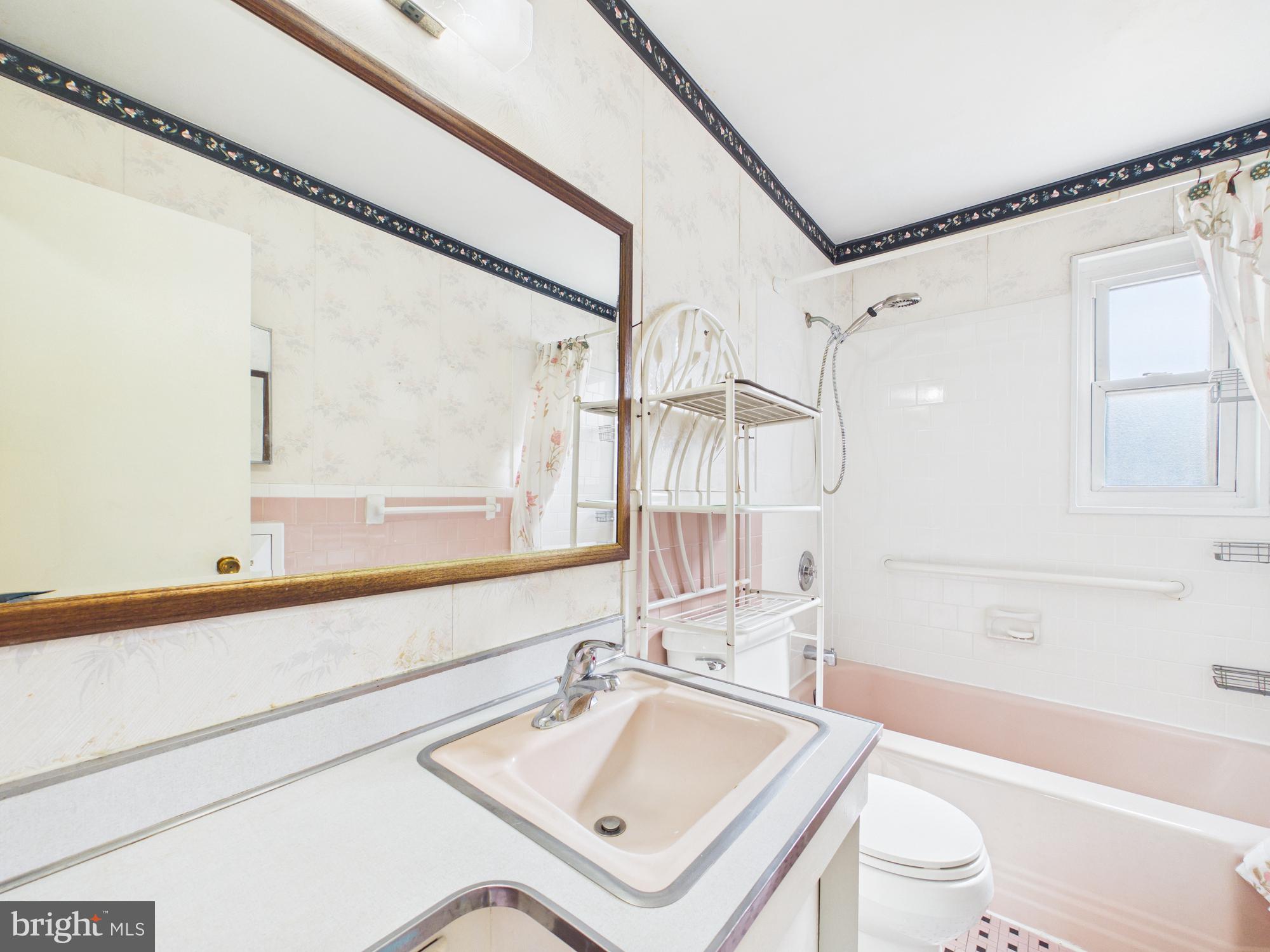 5907 Camberly Avenue Springfield, VA 22150 - Photo 27 of 41 a bathroom with a sink a toilet and a bathtub