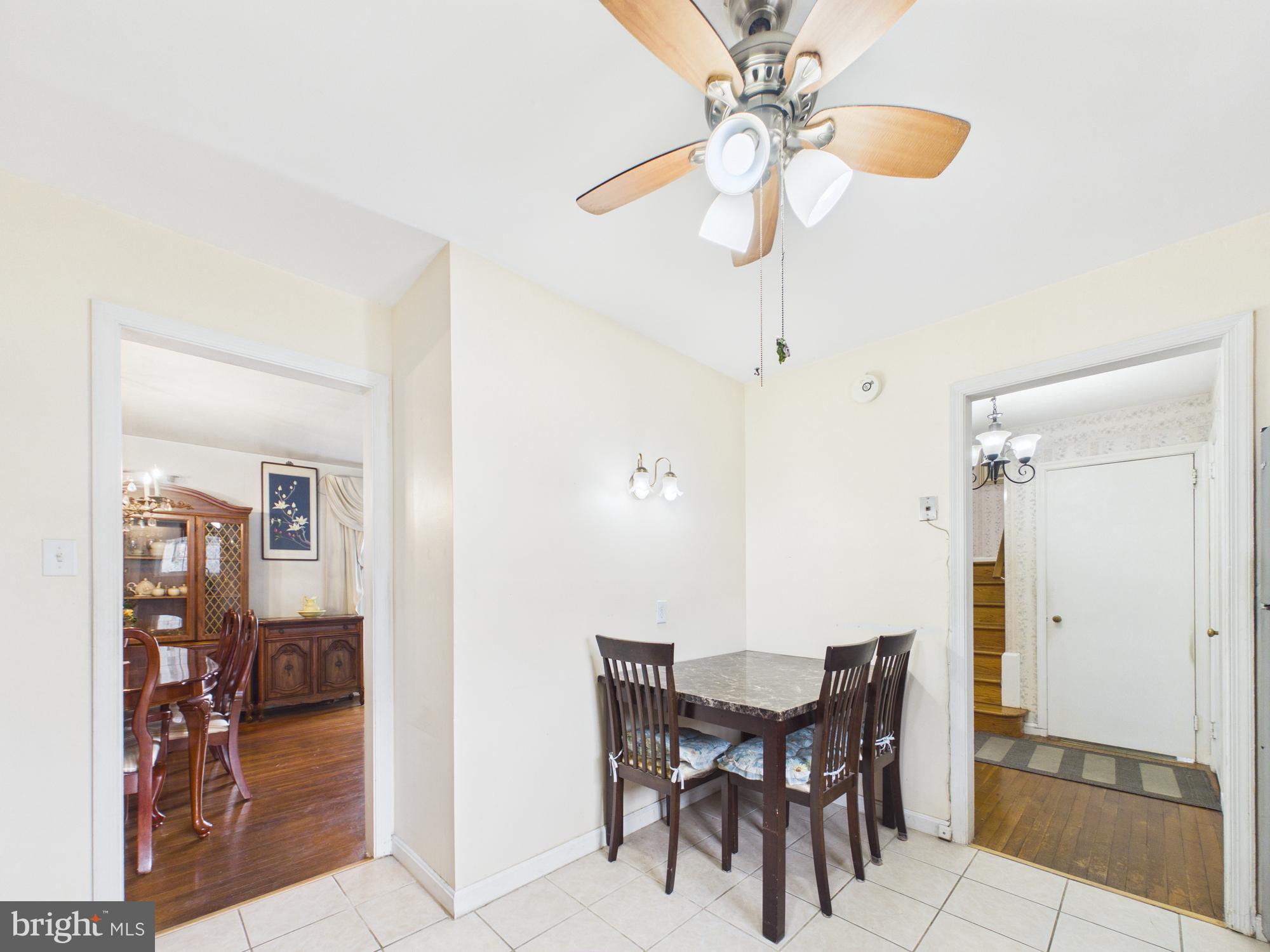 5907 Camberly Avenue Springfield, VA 22150 - Photo 3 of 41 a view of a dining room with furniture and chandelier fan