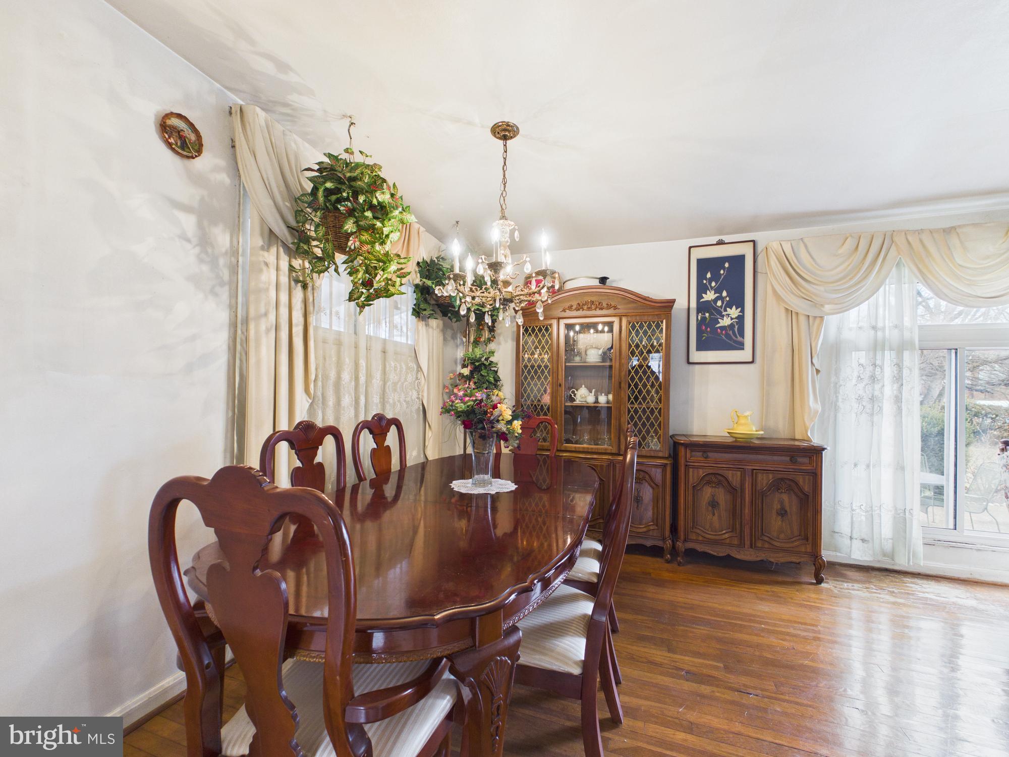 5907 Camberly Avenue Springfield, VA 22150 - Photo 10 of 41 a view of a dining room with furniture window and wooden floor