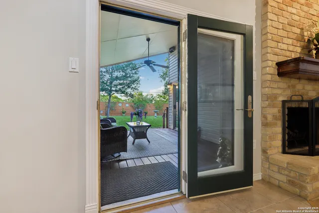 a view of a porch and a floor to ceiling window