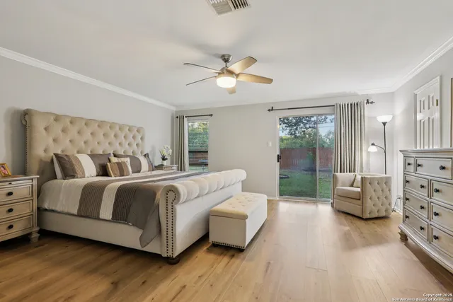 a living room with a bed and furniture