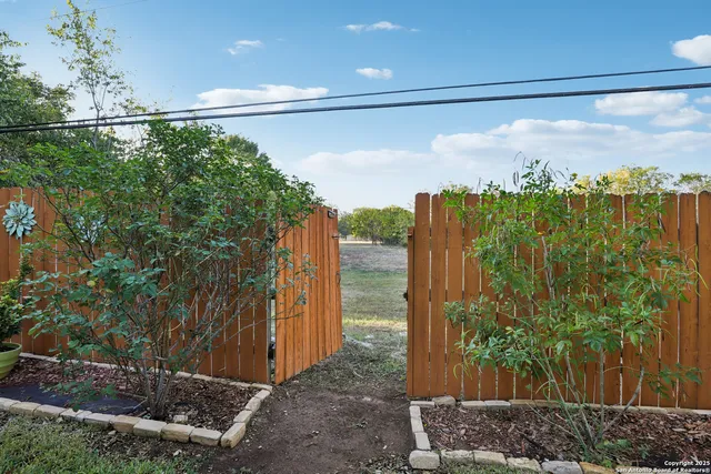 a view of a city from a corridor