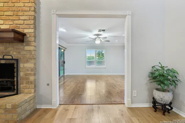 a view of an entryway with wooden floor