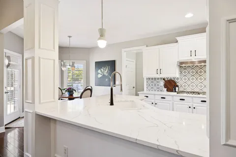 a kitchen with counter top space and cabinets
