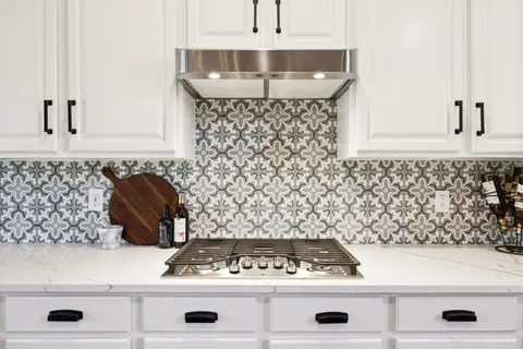 a kitchen with a stove and cabinets