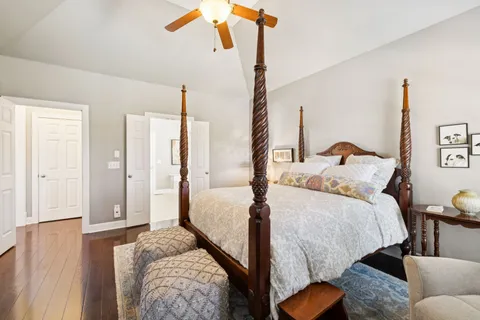 a bedroom with bed and a closet