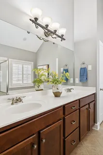 a bathroom with a sink double vanity and a mirror