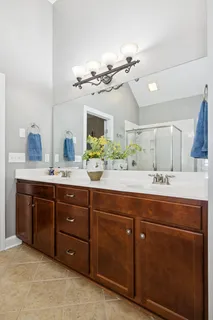 a bath room with a sink and a mirror