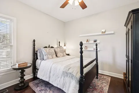 a bedroom with bed and a window