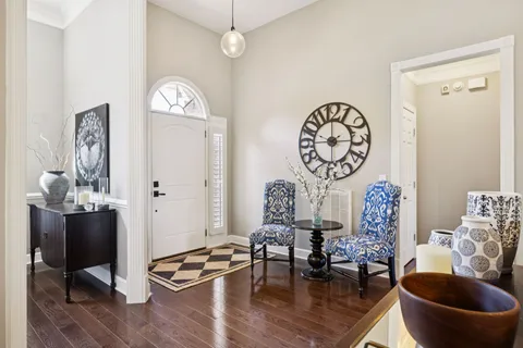 a living room with furniture a window and a table