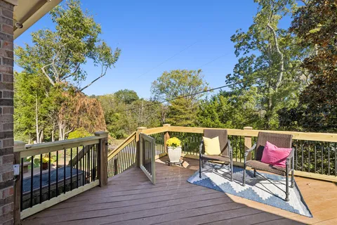 a view of roof deck with furniture