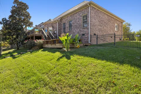a backyard of a house with lots of green space